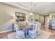 Bright dining area with buffet and decor, seamlessly connects to the kitchen for modern living at 120 Magnolia House Dr, Summerville, SC 29486