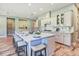 Spacious kitchen island with marble countertop, seating, and modern appliances for cooking and entertaining at 120 Magnolia House Dr, Summerville, SC 29486