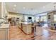 Modern, open kitchen with a large island, stainless steel appliances, and seamless flow into living and dining areas at 120 Magnolia House Dr, Summerville, SC 29486