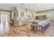 Modern kitchen featuring white cabinets, a center island with seating, stainless steel appliances and hardwood floors at 120 Magnolia House Dr, Summerville, SC 29486