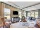 Cozy living area with large windows, a flat-screen TV, and a dining nook for casual meals at 120 Magnolia House Dr, Summerville, SC 29486