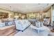 Open-concept living space with a dining area, kitchen, hardwood floors, and stylish contemporary furnishings at 120 Magnolia House Dr, Summerville, SC 29486