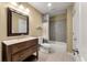 Bathroom featuring a wood vanity, tile floors, decorative backsplash, and shower-tub combination at 129 Dunbury Dr, Summerville, SC 29485