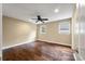 Inviting bedroom with hardwood flooring, neutral walls, ceiling fan and large windows for natural light at 129 Dunbury Dr, Summerville, SC 29485