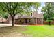 Charming brick home with a well-manicured lawn, mature trees, and inviting curb appeal at 129 Dunbury Dr, Summerville, SC 29485