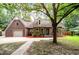 Traditional brick home featuring an attached garage, and established landscaping at 129 Dunbury Dr, Summerville, SC 29485