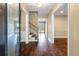 Welcoming foyer with hardwood floors, staircase, and views into the adjoining rooms at 129 Dunbury Dr, Summerville, SC 29485
