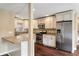 Bright kitchen with stainless steel appliances and granite counters, seamlessly connected to living spaces at 129 Dunbury Dr, Summerville, SC 29485