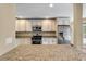 Updated kitchen boasting granite counters, stainless steel appliances, and ample cabinet space for storage at 129 Dunbury Dr, Summerville, SC 29485