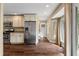 Kitchen with stainless steel fridge, granite counters, and hardwood flooring leading to the home's entrance at 129 Dunbury Dr, Summerville, SC 29485
