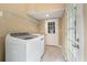 Clean laundry room with modern appliances, a utility sink, and easy access to the exterior at 129 Dunbury Dr, Summerville, SC 29485