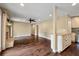 Spacious living room with hardwood floors, neutral paint, and an open layout connecting seamlessly to the kitchen at 129 Dunbury Dr, Summerville, SC 29485