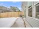 Backyard featuring gray siding, wood fence, and a concrete patio at 134 Brown Swiss Cir, Summerville, SC 29483