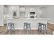 A bright kitchen island with stainless steel appliances and white cabinetry at 134 Brown Swiss Cir, Summerville, SC 29483