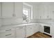 Kitchen with white cabinets, white countertops, stainless steel appliances, and hardwood floors at 1479 Jeremy Cay Ct, Awendaw, SC 29429