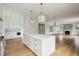 Spacious kitchen with center island, hardwood floors and stainless steel appliances at 1479 Jeremy Cay Ct, Awendaw, SC 29429