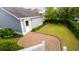 Aerial view of the private backyard featuring a charming patio, grassy area, and manicured landscaping at 1517 Willtown St, Charleston, SC 29492
