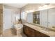 Bright primary bathroom with dual sinks, soaking tub, and a separate shower at 1517 Willtown St, Charleston, SC 29492