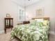 Inviting bedroom with tropical bedding, natural light, and wicker accents at 1517 Willtown St, Charleston, SC 29492