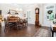 Elegant dining room with hardwood floors, wainscoting, and a traditional grandfather clock at 1517 Willtown St, Charleston, SC 29492