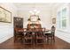 Formal dining room features hardwood floors, classic furnishings, and ample natural light at 1517 Willtown St, Charleston, SC 29492