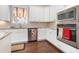 Kitchen boasts stainless steel appliances, custom cabinets, and granite countertops at 1517 Willtown St, Charleston, SC 29492