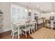 Eat-in kitchen and dining area with stainless appliances, white cabinets and hardwood floors at 1517 Willtown St, Charleston, SC 29492