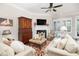 Comfortable living room featuring a fireplace, ceiling fan, and stylish coastal decor accents at 1517 Willtown St, Charleston, SC 29492