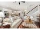 Open-concept living area leads into a modern kitchen with stainless steel appliances and island seating at 1517 Willtown St, Charleston, SC 29492