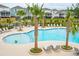 Resort style pool surrounded by beach chairs and lush landscaping near beautiful homes at 1754 Cultivation Ln # 513, Mount Pleasant, SC 29466