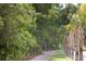 Picturesque walking trail surrounded by lush greenery, providing a serene and refreshing outdoor experience at 1754 Cultivation Ln # 513, Mount Pleasant, SC 29466
