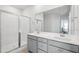 Modern bathroom features double sinks, a large mirror, and a walk-in shower at 1801 Sandybrook Dr, Mount Pleasant, SC 29466