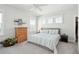 Bright bedroom features neutral colors, hardwood floors, and lots of natural light at 1801 Sandybrook Dr, Mount Pleasant, SC 29466