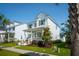 Inviting two-story home featuring a cozy front porch, lush landscaping, and a charming neighborhood setting at 1801 Sandybrook Dr, Mount Pleasant, SC 29466
