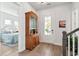 Elegant foyer featuring hardwood floors, a decorative cabinet, and a view of the front door, creating a grand entrance at 1801 Sandybrook Dr, Mount Pleasant, SC 29466