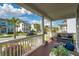 Spacious front porch offering stunning views of the neighborhood, comfortable seating, and lush greenery at 1801 Sandybrook Dr, Mount Pleasant, SC 29466