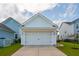 Attached two car garage on a home with a neatly paved driveway at 1801 Sandybrook Dr, Mount Pleasant, SC 29466