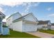 Attached two car garage with a neatly paved driveway and manicured lawn at 1801 Sandybrook Dr, Mount Pleasant, SC 29466