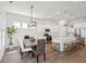 Open concept with kitchen island, dining area, stainless steel appliances, and wood flooring at 1801 Sandybrook Dr, Mount Pleasant, SC 29466