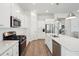 Bright kitchen featuring white cabinets, stainless steel appliances, and a large quartz island at 1801 Sandybrook Dr, Mount Pleasant, SC 29466