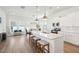 Open kitchen features white cabinets, a center island with seating, and stainless steel appliances at 1801 Sandybrook Dr, Mount Pleasant, SC 29466