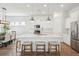 Well-lit kitchen with a center island, pendant lighting, and an adjacent dining area at 1801 Sandybrook Dr, Mount Pleasant, SC 29466