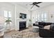 Bright living room featuring a fireplace, shiplap accent wall, and plush seating area at 1801 Sandybrook Dr, Mount Pleasant, SC 29466