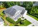Aerial view showing roof, driveway and manicured yard with a two-car garage at 188 Donning Dr, Summerville, SC 29483