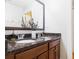 Bathroom featuring double sinks with granite countertop and modern fixtures with views to the shower at 188 Donning Dr, Summerville, SC 29483