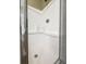 Bright white tiled shower stall with built-in shelves and chrome hardware at 188 Donning Dr, Summerville, SC 29483
