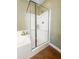 Well lit shower stall with white tile, glass door, and chrome shower head at 188 Donning Dr, Summerville, SC 29483