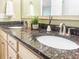 Bathroom featuring tiled floors and a vanity with black granite at 188 Donning Dr, Summerville, SC 29483