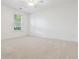 Bright bedroom featuring neutral carpet, a window, and a ceiling fan for added comfort at 188 Donning Dr, Summerville, SC 29483