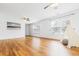 Large room with hardwood floors, multiple windows, ceiling fans, and a bohemian tent at 188 Donning Dr, Summerville, SC 29483
